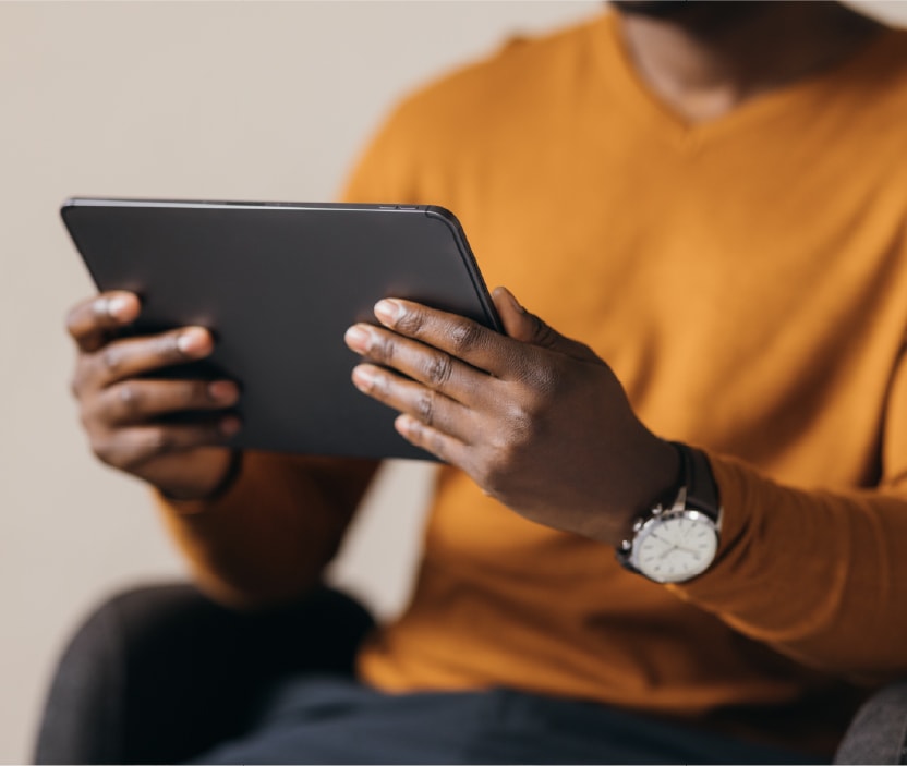 A person reads about data brokers on their tablet.